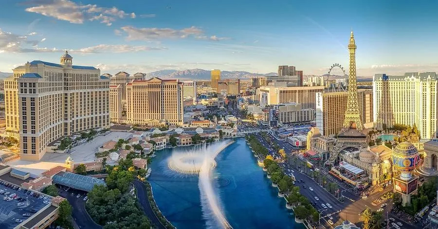 Aerial photograph of the Las Vegas Strip at dusk, used as the image for both Expedia ads.